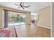 Bright living area with tile floors, access to the pool, and seamless flow to the dining room at 1569 Victoria Way, Winter Garden, FL 34787
