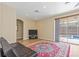 Spacious living area with tile floors, neutral walls, sliding doors to the pool, and ample natural light at 1569 Victoria Way, Winter Garden, FL 34787