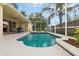 Relaxing pool and spa with screened enclosure and patio furniture at 1569 Victoria Way, Winter Garden, FL 34787