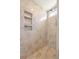 Shower with niche shelving, tile surround, and overhead shower head at 1569 Victoria Way, Winter Garden, FL 34787