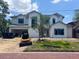 New two-story home featuring black-framed windows and an attached two-car garage under construction at 1830 Park Lake St, Orlando, FL 32803