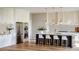 Gourmet kitchen boasts stainless steel appliances, white cabinetry, and a large island with seating at 1830 Park Lake St, Orlando, FL 32803