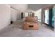 Bright living room with vaulted ceilings, sliding glass doors, awaiting personalization and finishing touches at 1830 Park Lake St, Orlando, FL 32803