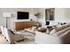 Spacious living room featuring a neutral color palette, plush sofas, and a large TV at 1830 Park Lake St, Orlando, FL 32803