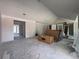 Bright, expansive living room with vaulted ceilings, awaiting personalization and finishing touches at 1830 Park Lake St, Orlando, FL 32803