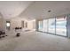 Bright living room with high ceilings and large sliding glass doors to the backyard at 1830 Park Lake St, Orlando, FL 32803