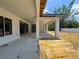 Expansive covered patio featuring sleek sliding glass doors, ideal for entertaining and relaxation at 1830 Park Lake St, Orlando, FL 32803