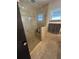 Large walk-in shower with glass enclosure and neutral tile at 218 Wgto Tower Rd, Lake Alfred, FL 33850