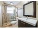 Updated bathroom with a walk-in shower and modern vanity at 2225 Kettle Dr, Orlando, FL 32835