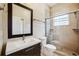 Bathroom with a modern vanity, toilet, and glass shower enclosure at 2225 Kettle Dr, Orlando, FL 32835