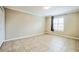 Bedroom featuring neutral wall color, tiled floor and large window with natural light at 2225 Kettle Dr, Orlando, FL 32835
