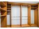 A beautiful walk-in closet with custom wood shelving and hanging rods for optimal storage at 2225 Kettle Dr, Orlando, FL 32835