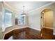 Dining room features hardwood floors, and a lovely light fixture next to an arched doorway at 2225 Kettle Dr, Orlando, FL 32835