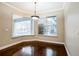 Bright dining room features hardwood floors and a view of the backyard pool area at 2225 Kettle Dr, Orlando, FL 32835