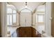 Elegant foyer featuring arched doorways, columns, and tile flooring with wood inlay at 2225 Kettle Dr, Orlando, FL 32835