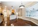 Kitchen with an island, wood cabinets, and dark hardwood floors at 2225 Kettle Dr, Orlando, FL 32835