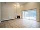 Bright living room with a fireplace, tile floors, and pool view at 2225 Kettle Dr, Orlando, FL 32835