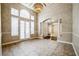 Bright living room featuring high ceilings, tile flooring, and French doors at 2225 Kettle Dr, Orlando, FL 32835