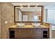 Bathroom vanity area features mosaic tiles, dual sinks, and a large mirror at 2225 Kettle Dr, Orlando, FL 32835