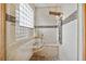 The luxury shower features a glass enclosure, a built-in seat, and a modern multi-jet shower panel at 2225 Kettle Dr, Orlando, FL 32835
