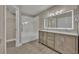 Modern bathroom with double vanity and large mirror at 2267 Santa Lucia St, Kissimmee, FL 34743