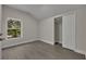 Bright bedroom featuring wood-look floors and a spacious closet at 2267 Santa Lucia St, Kissimmee, FL 34743