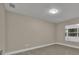 Bright bedroom with large window and wood-look floors at 2267 Santa Lucia St, Kissimmee, FL 34743