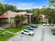 Condo complex with red roofs and lush green surroundings at 234 Afton Sq # 205, Altamonte Springs, FL 32714