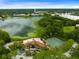 Community clubhouse, tennis courts, and lake; scenic view of surroundings at 234 Afton Sq # 205, Altamonte Springs, FL 32714