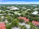 An aerial view of a community with red tile roofs and ample parking at 236 Afton Sq # 309, Altamonte Springs, FL 32714