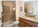 Well-appointed bathroom with shower and granite vanity at 3045 Beach Palm Ave, Kissimmee, FL 34747