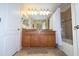 Clean bathroom with double sinks, granite countertops, and a tub at 3045 Beach Palm Ave, Kissimmee, FL 34747