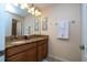 Double vanity bathroom with granite countertop at 3045 Beach Palm Ave, Kissimmee, FL 34747