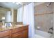 Bathroom with tub, shower, and granite countertop at 3045 Beach Palm Ave, Kissimmee, FL 34747