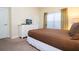 Bedroom with a queen bed and dresser at 3045 Beach Palm Ave, Kissimmee, FL 34747
