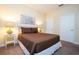 Bedroom with a queen bed and nightstand at 3045 Beach Palm Ave, Kissimmee, FL 34747