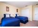 Bedroom with two twin beds and closet at 3045 Beach Palm Ave, Kissimmee, FL 34747