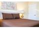 Bedroom with a queen bed and nightstand at 3045 Beach Palm Ave, Kissimmee, FL 34747
