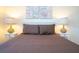 Bedroom with a queen bed and two nightstands at 3045 Beach Palm Ave, Kissimmee, FL 34747