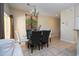 Bright dining room with glass table and chairs at 3045 Beach Palm Ave, Kissimmee, FL 34747