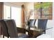 Dining room with glass table and chairs at 3045 Beach Palm Ave, Kissimmee, FL 34747