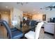 Open dining room with a glass-top table and seating for six at 3045 Beach Palm Ave, Kissimmee, FL 34747