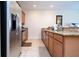 Kitchen with stainless steel appliances and granite countertops at 3045 Beach Palm Ave, Kissimmee, FL 34747