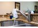 Modern kitchen sink with granite countertop at 3045 Beach Palm Ave, Kissimmee, FL 34747