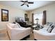 Relaxing living room with comfortable sofas, a large TV, and a coffee table at 3045 Beach Palm Ave, Kissimmee, FL 34747