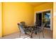 Private patio with table and chairs, perfect for outdoor dining at 3045 Beach Palm Ave, Kissimmee, FL 34747