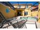 Private screened pool area with lounge chairs at 3045 Beach Palm Ave, Kissimmee, FL 34747