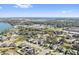 Aerial view of community near lake, showcasing homes and landscape at 310 Lake Mariana Pl, Auburndale, FL 33823