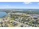 Aerial view of community near lake, showcasing homes and landscape at 310 Lake Mariana Pl, Auburndale, FL 33823