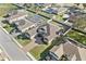 Aerial view of a house with pool and landscaped yard at 310 Lake Mariana Pl, Auburndale, FL 33823